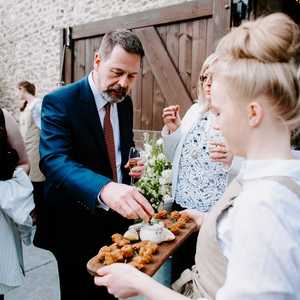 Canapes Fossil Food Catering waitress pouring champagne